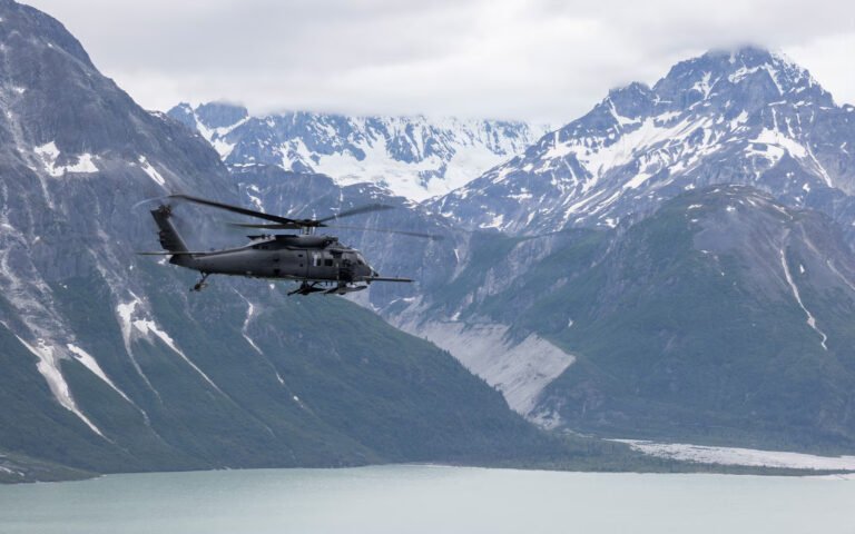 Alaska, United States: Four people were rescued after a Cessna 180 crashed and overturned on a coastal sandbar on Alaska’s Montague Island on August 30, 2026 with Alaska Air National Guard personnel responding to the remote site and transporting all four occupants to a hospital in Anchorage. The crash occurred on a coastal sandbar on Montague Island, about 60 miles southeast of Seward, Alaska, according to the Alaska National Guard. The aircraft was identified as a Cessna 180 carrying four people. The official report did not release the occupants’ names, the aircraft’s registration, the exact flight route or a specific cause of the crash. The rescue operation began after the Alaska Rescue Coordination Center (AKRCC) at Joint Base Elmendorf-Richardson received a signal from the aircraft’s 406 MHz emergency locator transmitter (ELT). The ELT was registered to the owner of the Cessna 180, allowing authorities to identify the aircraft associated with the emergency signal. The people involved in the incident also had a consumer-grade two-way satellite communication device. According to the Alaska National Guard, the device helped maintain the flow of information with the AKRCC and assisted rescuers in obtaining a more precise location of the crash site. Following the alert, the AKRCC requested assistance from the Alaska Air National Guard’s 176th Wing search-and-rescue duty officer. A HH-60W Jolly Green II helicopter from the 210th Rescue Squadron was dispatched with pararescuemen from the 212th Rescue Squadron, commonly known as PJs, aboard. When the rescue team reached the crash site, the Cessna had overturned. Despite its position, the aircraft appeared to be seemingly undamaged, and the four occupants had managed to get themselves out before the pararescuemen reached them. The rescue operation required additional caution because the aircraft had come down on a coastal sandbar. Flying sand and beach debris posed a hazard to the helicopter, so the HH-60W crew landed at a safe distance from the crash site rather than directly next to the occupants. The pararescuemen then made contact with the four people and assessed their condition. One occupant had suffered a back injury. The PJs stabilized the injured person using a vacuum splint and cervical collar before securing the occupant in a Stokes litter for helicopter transportation. The HH-60W crew subsequently flew the injured occupant and the other three people to Providence Alaska Medical Center in Anchorage. They were handed over to civilian medical personnel at the hospital. The Alaska National Guard said the incident also demonstrated the importance of reliable emergency-location and communication equipment during aircraft emergencies in remote areas. AKRCC officials urged aircraft owners to keep their 406 MHz ELT registrations current and encouraged pilots to carry an additional satellite communication device to help speed up rescue operations. The Alaska National Guard reported that all four occupants were rescued from the crash site and transported for medical care. The agency did not provide further information on the occupants’ identities or disclose what caused the Cessna 180 to crash.
