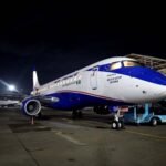 Lagos, Nigeria: The Nigeria Civil Aviation Authority’s August 2026 domestic flight-disruption report has come under challenge from Air Peace, United Nigeria Airlines and ValueJet, with the carriers questioning the regulator’s flight-count data and its failure to distinguish delays caused by airlines from those linked to airports, weather, infrastructure and other external factors. The NCAA, in its report released on 13 September 2026, said 15 domestic airlines operated 7,961 flights in August, of which 4,765 were delayed and 36 cancelled. Air Peace was listed with 1,864 flights and 1,330 delays, giving it a 71.4% delay rate, while United Nigeria recorded 943 delays from 1,231 flights, the highest delay rate at 76.6%. ValueJet recorded 435 delays from 767 flights, or 56.7%. The NCAA said 2,801 delays lasted between 16 minutes and one hour, 1,322 lasted one to two hours, 407 lasted two to three hours and 235 lasted at least three hours. Air Peace accounted for 108 of the longest delays. Air Peace challenged the figures on 17 September 2026 through a statement signed by its Chief Operating Officer, Oluwatoyin Olajide. The airline said it actually operated 2,564 flights in August, rather than the 1,864 recorded by the NCAA, arguing that the omission of more than 700 flights distorted its performance metrics and inflated its reported delay rate. “By omitting over 700 fully operational flights from the data pool, the NCAA’s calculations skew our actual performance metrics and artificially inflate the reported delay percentages,” the airline said. Air Peace also questioned why the NCAA began its monthly disruption series with August instead of July, after publishing its first- and second-quarter disruption reports on 31 July. “Why did the NCAA start the monthly series with August rather than July, immediately following the publication of Q1 and Q2 on 31st of July?” the airline asked. It also questioned the publication of detailed August data only 13 days after the end of the month. Another major issue raised by Air Peace was the absence of an airline-by-airline breakdown of the causes of delays. The NCAA report provided the number and duration of delays but did not publicly attribute individual delays to internal airline factors or external circumstances. Air Peace argued that this presentation could leave the impression that the disruptions were primarily caused by airline operations. The airline said its own review found 391 flights affected by internal factors, mainly technical issues requiring unscheduled maintenance and fuel-related problems. It attributed the remaining disruptions to external factors including airport congestion and traffic, infrastructure deficiencies, adverse weather, bird strikes, aviation-union industrial action and aircraft damage by a ground-handling company. Air Peace said airport congestion and traffic accounted for more than 51% of its externally caused delays. Air Peace also pointed to a bird strike involving aircraft 5N-BYG in Abuja. The airline said the strike damaged the aircraft’s inlet cowl beyond acceptable limits, cost about US$1.8 million to repair and kept the aircraft out of service for more than a week. It said the aircraft normally operated at least eight sectors a day and carried about 1,000 passengers, meaning its removal affected subsequent rotations. The airline further said adverse weather during the rainy season caused safety holds and diversions, creating consequential delays across later flights. It also said aviation-union picketing that began on 11 August, 2026 affected its operations for more than 14 days, causing rescheduling, delays and cancellations. The NCAA had separately acknowledged the industrial action on 11 August, 2026 saying it was affecting passengers and other stakeholders and urging the unions to resolve the dispute. United Nigeria Airlines raised a similar methodological concern during the Aviation Day of the 23rd Akwaaba African Travel Market in Lagos on 15 September, 2026. Its Chief Commercial Officer, Adedayo Olawuyi, said the NCAA figures should distinguish between controllable and uncontrollable delays before carrier performance is assessed. “The first problem we have with that data, personally speaking, is that the data was not presented in a way where we have removed controllable delays and uncontrollable delays,” Olawuyi said. Olawuyi cited airport congestion, inadequate infrastructure, technical problems and weather as causes of disruption. He said aircraft can be ready for departure but remain blocked on ramps or delayed before accessing the runway because several operators are using limited airport capacity. He also described a recent United Nigeria Lagos-Kano flight affected by bad weather. According to Olawuyi, the flight eventually departed Lagos at about 10:30 p.m., but a thunderstorm at Kano disabled runway lighting before landing. The aircraft returned to Lagos and landed at about 1 a.m. “That’s not the fault of the airline,” he said. Olawuyi said many Nigerian airports have limited night-operating capability, meaning an earlier delay can extend beyond operating hours and result in cancellation. He argued that the regulator’s figures should therefore be assessed across the wider aviation system rather than attributed solely to carriers. ValueJet’s Chief Commercial Officer, Trevor Henry, made a similar argument at the same Lagos event. He cited presidential movements, weather, congestion at check-in and security points, crowded boarding lounges, boarding-gate congestion and taxiway and runway congestion as factors affecting schedules. “Delays and cancellations are usually caused by issues like presidential movements, weather, airport congestion at check-in, congestion in the boarding lounge due to security checks, and congestion at the boarding gate,” Henry said. The discussion also produced a proposed operational response from Murtala Muhammed Airport Terminal 2. MMA2 Chief Operating Officer Remi Jibodu said more than 10 airlines can schedule flights around 7 a.m., creating pressure on airport facilities. He proposed better coordination and staggered departure times, including consideration of a slot system to spread peak-hour traffic. The dispute therefore centres on two separate questions: whether the NCAA’s flight-volume figures accurately captured individual airline operations, and whether raw delay totals are sufficient to assess airline performance without identifying the causes of each disruption. The NCAA has not publicly responded in the sources reviewed to Air Peace’s specific claim that 700 flights were omitted from its August total. Its published report remains the regulator’s official August disruption dataset, while the airlines’ alternative figures and causal breakdowns remain claims from the respective carriers pending reconciliation with the NCAA.