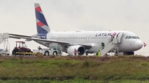 Cascavel, Brazil: A LATAM Airlines Brasil Airbus A320 carrying 151 people left the paved runway while landing at Cascavel Regional Airport in Paraná, Brazil, on August 31, 2026. The aircraft, operating flight LA3858 from São Paulo–Guarulhos International Airport to Cascavel, came to rest on soft, rain-soaked ground beside the runway. All 145 passengers and six crew members were evacuated safely, with no injuries reported. Flight LA3858 departed São Paulo-Guarulhos International Airport and was scheduled to arrive at Cascavel, approximately 710 km west of Curitiba. Flightradar24 data shows PR-MYO departed Guarulhos at about 11:19 UTC and landed at Cascavel at approximately 12:47 UTC, corresponding to about 9:47 a.m. local time. LATAM placed the occurrence at approximately 9:45 a.m. local time. The incident occurred amid rain, thunderstorms and reduced visibility around Cascavel. Weather observations for the airport recorded thunderstorms and rain in the period surrounding the aircraft's arrival, with visibility at one point reduced to about 3,000 metres. Other reports noted heavy rain and standing water around the runway area. According to tracking-based reports, the aircraft landed on Runway 15 and decelerated normally. It slowed to approximately 15 knots before the crew began a turn to backtrack along the runway. During that low-speed maneuver, the A320 departed the paved surface and entered the soft ground beside the runway, where its landing gear became partially embedded in mud. LATAM itself described the occurrence more broadly as the aircraft exceeding the runway limit during the final stage of landing. The airline has not publicly confirmed that aquaplaning, inadequate braking, runway contamination or any other specific factor caused the aircraft to leave the pavement. Although the heavy rain and wet surface are relevant circumstances, the available reports do not establish them as the confirmed cause. The airline said in its statement: “LATAM Airlines Brasil reports that the aircraft operating flight LA3858 (Guarulhos–Cascavel) on Monday (August 31) exceeded the runway limit during the final stage of its landing at approximately 9:45 a.m. local time. All 145 passengers and six crew members disembarked safely, and there were no injuries.” LATAM added that it was “providing all necessary assistance to passengers and employees” and that it was cooperating with authorities investigating the occurrence while evaluating the conditions required to remove the aircraft. The airline also reiterated that it maintains technical and operational safety measures to ensure safe travel. The runway was closed following the incident because the aircraft remained off the paved surface and had to be assessed and recovered. The closure disrupted operations at Cascavel Airport, while the return service LA3859 from Cascavel to São Paulo–Guarulhos was cancelled. LATAM said passengers affected by the cancellation were being accommodated on other services. There were no reported fatalities or injuries among the 151 occupants. Images and passenger videos published by several outlets showed the A320 standing off the runway in muddy ground and standing water, with passengers being assisted away from the aircraft. The cause of the runway excursion has not been officially established. Brazilian aviation authorities are expected to examine the aircraft's flight parameters, weather conditions, runway surface and braking performance, as well as the circumstances surrounding the aircraft's departure from the paved surface. Brazil's Aeronautical Accidents Investigation and Prevention Center (CENIPA) is involved in the technical investigation, although a definitive causal finding had not been released at the time of the reports reviewed. The occurrence is therefore being treated as a runway excursion/aviation incident, rather than a crash. Cascavel, Brazil: A LATAM Airlines Brasil Airbus A320 carrying 151 people left the paved runway while landing at Cascavel Regional Airport in Paraná, Brazil, on August 31, 2026. The aircraft, operating flight LA3858 from São Paulo–Guarulhos International Airport to Cascavel, came to rest on soft, rain-soaked ground beside the runway. All 145 passengers and six crew members were evacuated safely, with no injuries reported. Flight LA3858 departed São Paulo-Guarulhos International Airport and was scheduled to arrive at Cascavel, approximately 710 km west of Curitiba. Flightradar24 data shows PR-MYO departed Guarulhos at about 11:19 UTC and landed at Cascavel at approximately 12:47 UTC, corresponding to about 9:47 a.m. local time. LATAM placed the occurrence at approximately 9:45 a.m. local time. The incident occurred amid rain, thunderstorms and reduced visibility around Cascavel. Weather observations for the airport recorded thunderstorms and rain in the period surrounding the aircraft's arrival, with visibility at one point reduced to about 3,000 metres. Other reports noted heavy rain and standing water around the runway area. According to tracking-based reports, the aircraft landed on Runway 15 and decelerated normally. It slowed to approximately 15 knots before the crew began a turn to backtrack along the runway. During that low-speed maneuver, the A320 departed the paved surface and entered the soft ground beside the runway, where its landing gear became partially embedded in mud. LATAM itself described the occurrence more broadly as the aircraft exceeding the runway limit during the final stage of landing. The airline has not publicly confirmed that aquaplaning, inadequate braking, runway contamination or any other specific factor caused the aircraft to leave the pavement. Although the heavy rain and wet surface are relevant circumstances, the available reports do not establish them as the confirmed cause. The airline said in its statement: “LATAM Airlines Brasil reports that the aircraft operating flight LA3858 (Guarulhos–Cascavel) on Monday (August 31) exceeded the runway limit during the final stage of its landing at approximately 9:45 a.m. local time. All 145 passengers and six crew members disembarked safely, and there were no injuries.” LATAM added that it was “providing all necessary assistance to passengers and employees” and that it was cooperating with authorities investigating the occurrence while evaluating the conditions required to remove the aircraft. The airline also reiterated that it maintains technical and operational safety measures to ensure safe travel. The runway was closed following the incident because the aircraft remained off the paved surface and had to be assessed and recovered. The closure disrupted operations at Cascavel Airport, while the return service LA3859 from Cascavel to São Paulo–Guarulhos was cancelled. LATAM said passengers affected by the cancellation were being accommodated on other services. There were no reported fatalities or injuries among the 151 occupants. Images and passenger videos published by several outlets showed the A320 standing off the runway in muddy ground and standing water, with passengers being assisted away from the aircraft. The cause of the runway excursion has not been officially established. Brazilian aviation authorities are expected to examine the aircraft's flight parameters, weather conditions, runway surface and braking performance, as well as the circumstances surrounding the aircraft's departure from the paved surface. Brazil's Aeronautical Accidents Investigation and Prevention Center (CENIPA) is involved in the technical investigation, although a definitive causal finding had not been released at the time of the reports reviewed. The occurrence is therefore being treated as a runway excursion/aviation incident, rather than a crash.