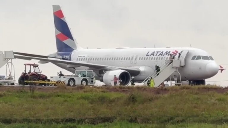 Cascavel, Brazil: A LATAM Airlines Brasil Airbus A320 carrying 151 people left the paved runway while landing at Cascavel Regional Airport in Paraná, Brazil, on August 31, 2026. The aircraft, operating flight LA3858 from São Paulo–Guarulhos International Airport to Cascavel, came to rest on soft, rain-soaked ground beside the runway. All 145 passengers and six crew members were evacuated safely, with no injuries reported. Flight LA3858 departed São Paulo-Guarulhos International Airport and was scheduled to arrive at Cascavel, approximately 710 km west of Curitiba. Flightradar24 data shows PR-MYO departed Guarulhos at about 11:19 UTC and landed at Cascavel at approximately 12:47 UTC, corresponding to about 9:47 a.m. local time. LATAM placed the occurrence at approximately 9:45 a.m. local time. The incident occurred amid rain, thunderstorms and reduced visibility around Cascavel. Weather observations for the airport recorded thunderstorms and rain in the period surrounding the aircraft's arrival, with visibility at one point reduced to about 3,000 metres. Other reports noted heavy rain and standing water around the runway area. According to tracking-based reports, the aircraft landed on Runway 15 and decelerated normally. It slowed to approximately 15 knots before the crew began a turn to backtrack along the runway. During that low-speed maneuver, the A320 departed the paved surface and entered the soft ground beside the runway, where its landing gear became partially embedded in mud. LATAM itself described the occurrence more broadly as the aircraft exceeding the runway limit during the final stage of landing. The airline has not publicly confirmed that aquaplaning, inadequate braking, runway contamination or any other specific factor caused the aircraft to leave the pavement. Although the heavy rain and wet surface are relevant circumstances, the available reports do not establish them as the confirmed cause. The airline said in its statement: “LATAM Airlines Brasil reports that the aircraft operating flight LA3858 (Guarulhos–Cascavel) on Monday (August 31) exceeded the runway limit during the final stage of its landing at approximately 9:45 a.m. local time. All 145 passengers and six crew members disembarked safely, and there were no injuries.” LATAM added that it was “providing all necessary assistance to passengers and employees” and that it was cooperating with authorities investigating the occurrence while evaluating the conditions required to remove the aircraft. The airline also reiterated that it maintains technical and operational safety measures to ensure safe travel. The runway was closed following the incident because the aircraft remained off the paved surface and had to be assessed and recovered. The closure disrupted operations at Cascavel Airport, while the return service LA3859 from Cascavel to São Paulo–Guarulhos was cancelled. LATAM said passengers affected by the cancellation were being accommodated on other services. There were no reported fatalities or injuries among the 151 occupants. Images and passenger videos published by several outlets showed the A320 standing off the runway in muddy ground and standing water, with passengers being assisted away from the aircraft. The cause of the runway excursion has not been officially established. Brazilian aviation authorities are expected to examine the aircraft's flight parameters, weather conditions, runway surface and braking performance, as well as the circumstances surrounding the aircraft's departure from the paved surface. Brazil's Aeronautical Accidents Investigation and Prevention Center (CENIPA) is involved in the technical investigation, although a definitive causal finding had not been released at the time of the reports reviewed. The occurrence is therefore being treated as a runway excursion/aviation incident, rather than a crash. Cascavel, Brazil: A LATAM Airlines Brasil Airbus A320 carrying 151 people left the paved runway while landing at Cascavel Regional Airport in Paraná, Brazil, on August 31, 2026. The aircraft, operating flight LA3858 from São Paulo–Guarulhos International Airport to Cascavel, came to rest on soft, rain-soaked ground beside the runway. All 145 passengers and six crew members were evacuated safely, with no injuries reported. Flight LA3858 departed São Paulo-Guarulhos International Airport and was scheduled to arrive at Cascavel, approximately 710 km west of Curitiba. Flightradar24 data shows PR-MYO departed Guarulhos at about 11:19 UTC and landed at Cascavel at approximately 12:47 UTC, corresponding to about 9:47 a.m. local time. LATAM placed the occurrence at approximately 9:45 a.m. local time. The incident occurred amid rain, thunderstorms and reduced visibility around Cascavel. Weather observations for the airport recorded thunderstorms and rain in the period surrounding the aircraft's arrival, with visibility at one point reduced to about 3,000 metres. Other reports noted heavy rain and standing water around the runway area. According to tracking-based reports, the aircraft landed on Runway 15 and decelerated normally. It slowed to approximately 15 knots before the crew began a turn to backtrack along the runway. During that low-speed maneuver, the A320 departed the paved surface and entered the soft ground beside the runway, where its landing gear became partially embedded in mud. LATAM itself described the occurrence more broadly as the aircraft exceeding the runway limit during the final stage of landing. The airline has not publicly confirmed that aquaplaning, inadequate braking, runway contamination or any other specific factor caused the aircraft to leave the pavement. Although the heavy rain and wet surface are relevant circumstances, the available reports do not establish them as the confirmed cause. The airline said in its statement: “LATAM Airlines Brasil reports that the aircraft operating flight LA3858 (Guarulhos–Cascavel) on Monday (August 31) exceeded the runway limit during the final stage of its landing at approximately 9:45 a.m. local time. All 145 passengers and six crew members disembarked safely, and there were no injuries.” LATAM added that it was “providing all necessary assistance to passengers and employees” and that it was cooperating with authorities investigating the occurrence while evaluating the conditions required to remove the aircraft. The airline also reiterated that it maintains technical and operational safety measures to ensure safe travel. The runway was closed following the incident because the aircraft remained off the paved surface and had to be assessed and recovered. The closure disrupted operations at Cascavel Airport, while the return service LA3859 from Cascavel to São Paulo–Guarulhos was cancelled. LATAM said passengers affected by the cancellation were being accommodated on other services. There were no reported fatalities or injuries among the 151 occupants. Images and passenger videos published by several outlets showed the A320 standing off the runway in muddy ground and standing water, with passengers being assisted away from the aircraft. The cause of the runway excursion has not been officially established. Brazilian aviation authorities are expected to examine the aircraft's flight parameters, weather conditions, runway surface and braking performance, as well as the circumstances surrounding the aircraft's departure from the paved surface. Brazil's Aeronautical Accidents Investigation and Prevention Center (CENIPA) is involved in the technical investigation, although a definitive causal finding had not been released at the time of the reports reviewed. The occurrence is therefore being treated as a runway excursion/aviation incident, rather than a crash.