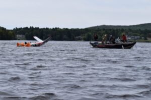 Wausau, United States: The National Transportation Safety Board (NTSB) preliminary report, reported publicly on 13 October 2026, details the pilot’s account, fuel-system inspection and aircraft damage. During a post-accident interview with a Federal Aviation Administration (FAA) inspector, the pilot’s aviation mechanic said the pilot attributed the power loss to his delay in switching tanks and not turning on the electric fuel-boost pump. The NTSB has not issued a final probable-cause determination, and the investigation remains ongoing. A delayed switch between fuel tanks and failure to activate the electric fuel-boost pump were cited by the pilot as reasons for the loss of engine power that forced a Beechcraft K35 carrying US lawmaker Tom Tiffany to make an emergency water landing in Lake Wausau, Wisconsin, on 12 September 2026. The aircraft, registered N6071E, was substantially damaged in the accident. Both occupants, pilot Leonard Boltz, 73, and passenger Tiffany, 68 sustained minor injuries and escaped from the aircraft before being rescued. The NTSB report states that the accident occurred at approximately 8:49 p.m. Central Daylight Time on 12 September 2026, near Wausau, Wisconsin. The Beech K35 was operating a personal flight under Part 91 of the US Federal Aviation Regulations from La Crosse Regional Airport to Wausau Downtown Airport. According to the report, the pilot was flying in the airport traffic pattern for landing at Wausau Downtown Airport. Shortly after extending the landing gear while abeam the runway threshold, he observed a “higher-than-normal engine exhaust gas temperature (EGT).” The report states: “According to the pilot, the higher-than-normal engine EGT reminded him to switch fuel tanks.” The pilot selected the right main fuel tank and moved the mixture and throttle levers fully forward, but the engine did not respond. He told investigators that he did not activate the electric fuel-boost pump while attempting to restore engine power. The pilot then maneuvered the aircraft towards the runway and prepared for a water landing. The aircraft struck the water, substantially damaging its fuselage, left wing, left aileron and engine mount. After the aircraft was recovered from Lake Wausau, investigators examined its fuel system and cockpit controls. The inspection found: The left main fuel tank was empty. The right main tank and both auxiliary fuel tanks were full of fuel. All fuel-tank caps were secure. The electric fuel-boost pump switch was in the OFF position. The fuel selector valve was positioned to the right main fuel tank. The throttle, mixture and propeller controls were nearly fully forward. These findings document the aircraft’s condition after the accident. The NTSB has not yet issued a final determination establishing the complete sequence of events that led to the loss of engine power. Earlier on 12 September, the pilot flew the aircraft from Langlade County Airport in Antigo, Wisconsin, to La Crosse Regional Airport. The aircraft departed Antigo with 70 gallons of fuel distributed across four tanks: 25 gallons in each main tank and 10 gallons in each auxiliary tank. The pilot did not refuel at La Crosse before departing for Wausau. He told investigators that he had selected the left main fuel tank for both flight legs, except for a brief period when he selected the auxiliary tanks during cruise flight before returning to the left tank. The flight from La Crosse to Wausau departed at approximately 8:15 p.m. local time. During the approach to Wausau, the pilot noticed the elevated exhaust gas temperature and switched to the right main tank. Despite advancing the engine controls, power was not restored. The NTSB report records the pilot’s explanation to his aviation mechanic following the accident: “the loss of engine power was due to his delay in switching fuel tanks and not turning on the electric fuel boost pump.” The aircraft landed in Lake Wausau after the pilot was unable to restore engine power. Both the occupants managed to exit the aircraft and reach shallow water. They called 911 and were rescued by a Wausau Fire Department airboat shortly after the accident. Both men sustained minor injuries. The aircraft remained in the water until recovery crews removed it on 14 September, with the recovery operation involving divers and other personnel. It was subsequently secured in a hangar for examination. The NTSB’s preliminary findings identify the pilot’s reported fuel-management errors and document the condition of the fuel tanks, selector valve and boost-pump switch after the accident. However, preliminary reports are subject to change as an investigation progresses. The report does not constitute a final probable-cause determination. Further investigative work may clarify the circumstances surrounding the engine-power loss and the emergency landing.