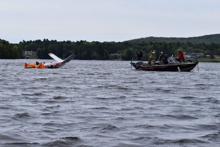 Wausau, United States: The National Transportation Safety Board (NTSB) preliminary report, reported publicly on 13 October 2026, details the pilot’s account, fuel-system inspection and aircraft damage. During a post-accident interview with a Federal Aviation Administration (FAA) inspector, the pilot’s aviation mechanic said the pilot attributed the power loss to his delay in switching tanks and not turning on the electric fuel-boost pump. The NTSB has not issued a final probable-cause determination, and the investigation remains ongoing. A delayed switch between fuel tanks and failure to activate the electric fuel-boost pump were cited by the pilot as reasons for the loss of engine power that forced a Beechcraft K35 carrying US lawmaker Tom Tiffany to make an emergency water landing in Lake Wausau, Wisconsin, on 12 September 2026. The aircraft, registered N6071E, was substantially damaged in the accident. Both occupants, pilot Leonard Boltz, 73, and passenger Tiffany, 68 sustained minor injuries and escaped from the aircraft before being rescued. The NTSB report states that the accident occurred at approximately 8:49 p.m. Central Daylight Time on 12 September 2026, near Wausau, Wisconsin. The Beech K35 was operating a personal flight under Part 91 of the US Federal Aviation Regulations from La Crosse Regional Airport to Wausau Downtown Airport. According to the report, the pilot was flying in the airport traffic pattern for landing at Wausau Downtown Airport. Shortly after extending the landing gear while abeam the runway threshold, he observed a “higher-than-normal engine exhaust gas temperature (EGT).” The report states: “According to the pilot, the higher-than-normal engine EGT reminded him to switch fuel tanks.” The pilot selected the right main fuel tank and moved the mixture and throttle levers fully forward, but the engine did not respond. He told investigators that he did not activate the electric fuel-boost pump while attempting to restore engine power. The pilot then maneuvered the aircraft towards the runway and prepared for a water landing. The aircraft struck the water, substantially damaging its fuselage, left wing, left aileron and engine mount. After the aircraft was recovered from Lake Wausau, investigators examined its fuel system and cockpit controls. The inspection found: The left main fuel tank was empty. The right main tank and both auxiliary fuel tanks were full of fuel. All fuel-tank caps were secure. The electric fuel-boost pump switch was in the OFF position. The fuel selector valve was positioned to the right main fuel tank. The throttle, mixture and propeller controls were nearly fully forward. These findings document the aircraft’s condition after the accident. The NTSB has not yet issued a final determination establishing the complete sequence of events that led to the loss of engine power. Earlier on 12 September, the pilot flew the aircraft from Langlade County Airport in Antigo, Wisconsin, to La Crosse Regional Airport. The aircraft departed Antigo with 70 gallons of fuel distributed across four tanks: 25 gallons in each main tank and 10 gallons in each auxiliary tank. The pilot did not refuel at La Crosse before departing for Wausau. He told investigators that he had selected the left main fuel tank for both flight legs, except for a brief period when he selected the auxiliary tanks during cruise flight before returning to the left tank. The flight from La Crosse to Wausau departed at approximately 8:15 p.m. local time. During the approach to Wausau, the pilot noticed the elevated exhaust gas temperature and switched to the right main tank. Despite advancing the engine controls, power was not restored. The NTSB report records the pilot’s explanation to his aviation mechanic following the accident: “the loss of engine power was due to his delay in switching fuel tanks and not turning on the electric fuel boost pump.” The aircraft landed in Lake Wausau after the pilot was unable to restore engine power. Both the occupants managed to exit the aircraft and reach shallow water. They called 911 and were rescued by a Wausau Fire Department airboat shortly after the accident. Both men sustained minor injuries. The aircraft remained in the water until recovery crews removed it on 14 September, with the recovery operation involving divers and other personnel. It was subsequently secured in a hangar for examination. The NTSB’s preliminary findings identify the pilot’s reported fuel-management errors and document the condition of the fuel tanks, selector valve and boost-pump switch after the accident. However, preliminary reports are subject to change as an investigation progresses. The report does not constitute a final probable-cause determination. Further investigative work may clarify the circumstances surrounding the engine-power loss and the emergency landing.
