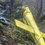 Joshimath, India: Six people, including the pilot, were killed after a helicopter crashed in the forested mountainous region near Chai village in Joshimath, Chamoli district, Uttarakhand, on Friday, October 30, 2026. The helicopter was flying from Badrinath to the Sahastradhara helipad in Dehradun with one pilot and five passengers when it crashed. The Ministry of Civil Aviation confirmed the accident in a statement issued through the Press Information Bureau (PIB) at 9:11 PM on Friday. According to the ministry, the helicopter operated by Trans Bharat Aviation, departed from Badrinath helipad at 1:14 PM and was en route to Sahastradhara helipad when the accident occurred. The ministry identified the crash location as the forest area near Chai village in Joshimath. The Ministry of Civil Aviation did not specify whether the service was a charter, scheduled passenger service or pilgrimage flight. Uttarakhand Civil Aviation Development Authority (UCADA) CEO Prateek Jain confirmed that all six occupants, including the pilot, had died. Chamoli District Magistrate Gaurav Kumar also confirmed the fatalities. The deceased included pilot Captain Himanshu Sabharwal, a resident of Delhi, and five passengers from Karnataka: Arun Salunke, Prathapa Bachihally Ningaraju, Shankar Gowda VB, Sudheer K and H.S. Nataraju. Karnataka Home Minister Priyank Kharge identified Arun Salunke as an inspector with the Bengaluru Police Central Crime Branch (CCB). The Karnataka government subsequently confirmed that the mortal remains of all six occupants had been recovered. According to UCADA, the helicopter lost communication while flying over the Joshimath valley, after which its tracking system also stopped receiving location information. The authority stated, "The helicopter lost communication while it was flying over Joshimath valley. At the same time, the tracking system could no longer track the helicopter." Chamoli Superintendent of Police Surjeet Singh Panwar said the aircraft's radar transmission link was lost near Joshimath approximately two minutes after its departure from Badrinath. Uttarakhand Secretary for Disaster Management and Rehabilitation Vinod Kumar Suman said the Chamoli District Disaster Management Officer informed the authorities at around 2 PM that a civilian helicopter had met with an accident. An Army Signal Centre team subsequently spotted smoke rising from the helicopter and observed it descending rapidly, prompting a coordinated search and rescue response. The Chamoli district administration, Indian Army, State Disaster Response Force (SDRF), Indo-Tibetan Border Police (ITBP), police and health department personnel were mobilised to locate the aircraft and reach the crash site. Uttarakhand Chief Minister Pushkar Singh Dhami confirmed the joint response, stating, "A joint rescue operation is being conducted by the district administration, disaster management department, and SDRF." He added, "I myself am continuously monitoring the entire incident." The Karnataka government, citing information from the Uttarakhand State Emergency Operations Centre, confirmed that rescue teams recovered the mortal remains of all six occupants. The remains were being brought to Joshimath for post-mortem examinations. The Chief Minister's Office and the Relief Commissioner of Karnataka coordinated with their Uttarakhand counterparts to facilitate the transportation of the deceased to Karnataka. Following the accident, UCADA in coordination with the Directorate General of Civil Aviation grounded the entire helicopter fleet operated by Trans Bharat Aviation Pvt Ltd as a precautionary measure. The Ministry of Civil Aviation also confirmed that a team from the Directorate General of Civil Aviation (DGCA) had been dispatched to Dehradun to conduct a preliminary and regulatory assessment of the accident. The exact cause of the crash has not yet been established. Although adverse weather conditions, including rain and reduced visibility, were reported in the region, authorities have not confirmed whether they contributed to the accident. The circumstances leading to the loss of communication and the subsequent crash remain subject to further assessment.